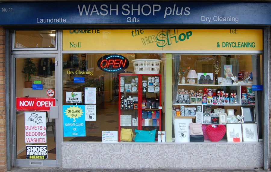 Photo of the shop frontage of a launderette.